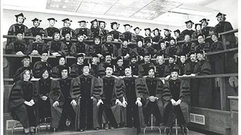 black and white photo of people in caps and gowns