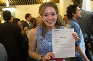 woman holding piece of paper