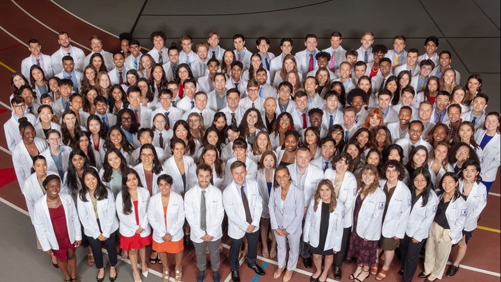 a large group of people posing for a photo