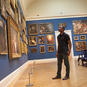 Man looking at artwork